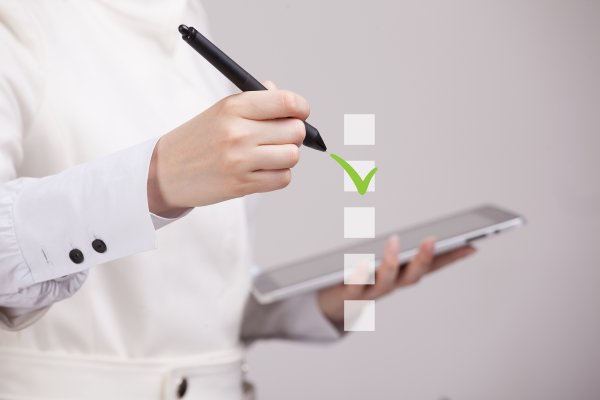 truthfinder cost background check service man checking on tablet